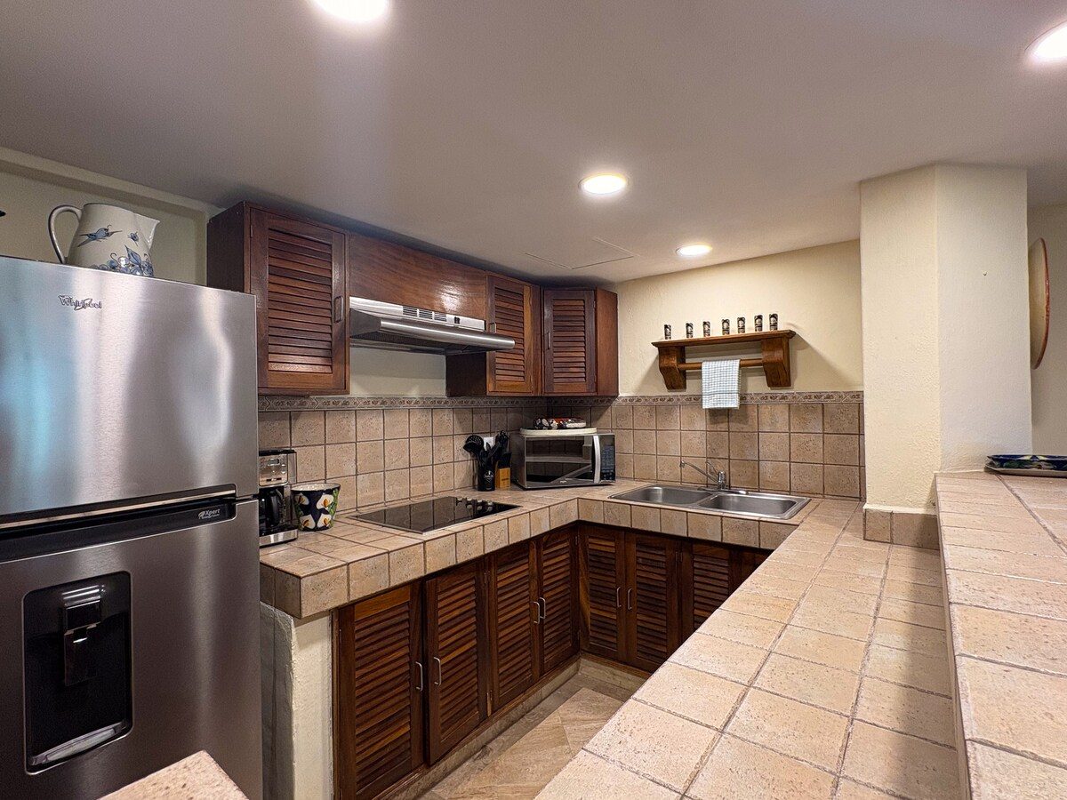 Kitchen with stainless refrigerator