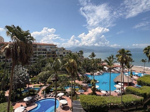 Resort pools, beach and Banderas Bay seen from the condo's terrace